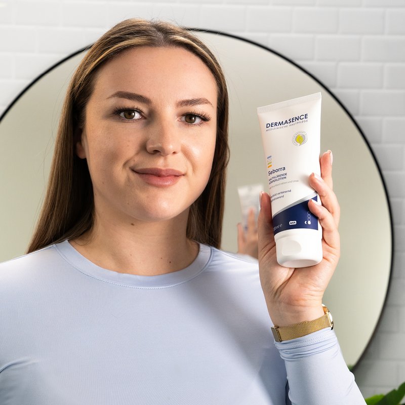 Photo of a woman applying the product.