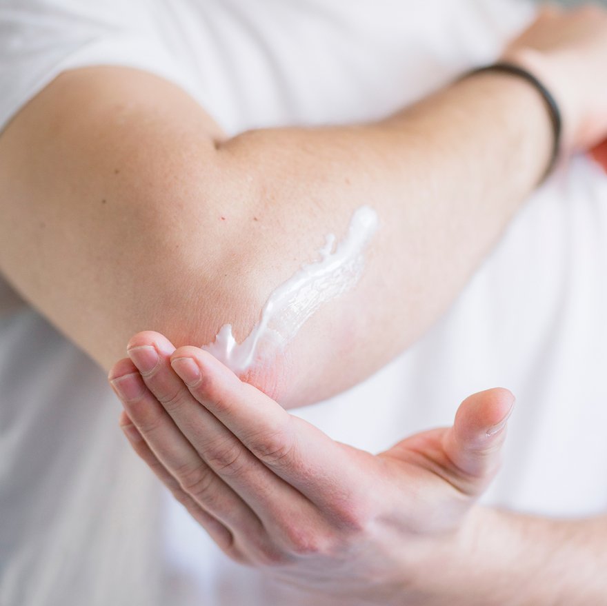 Man applies special care to his elbow