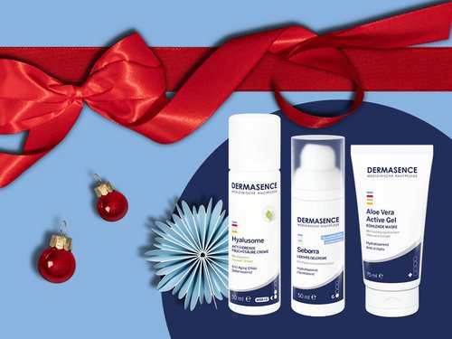 DERMASENCE-producten tegen een kerstachtige achtergrond 