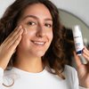 Photo of a woman applying the product.