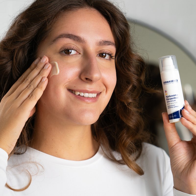 Photo of a woman applying the product.