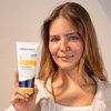 Photo of a woman applying the product.