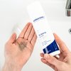 Photo of hands showing the texture of the product.