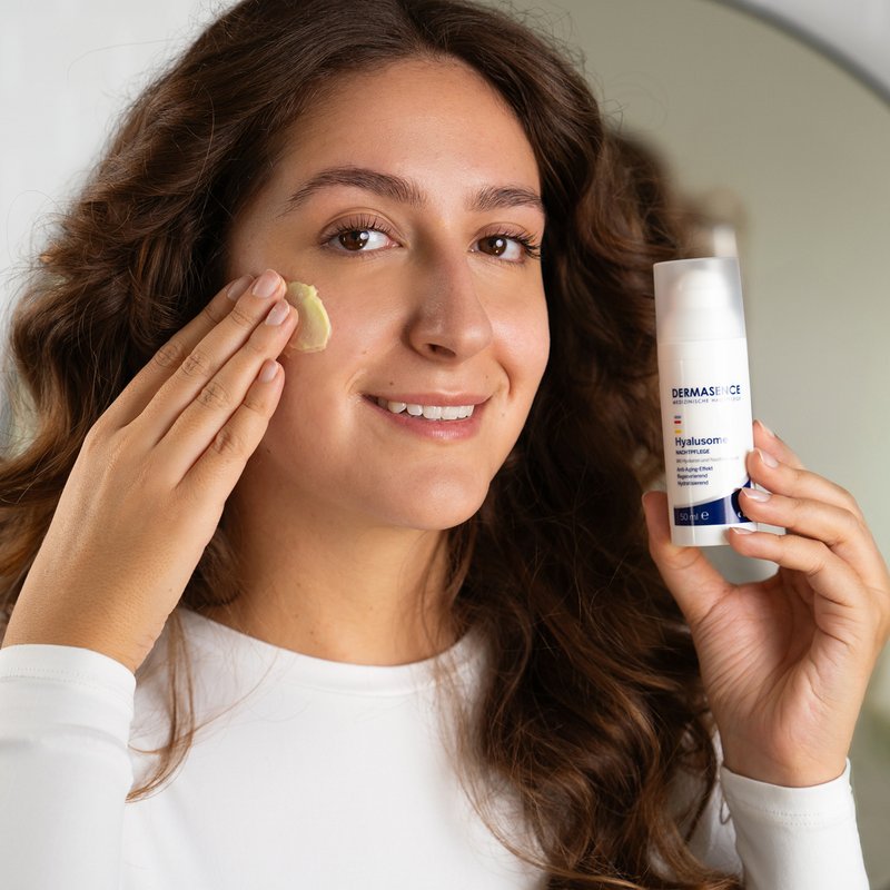 Photo of a woman applying the product.