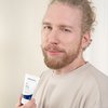 Photo of a man applying the product.