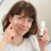 Photo of a woman applying the product.