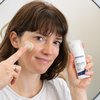 Photo of a woman applying the product.