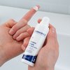 Photo of hands showing the texture of the product.