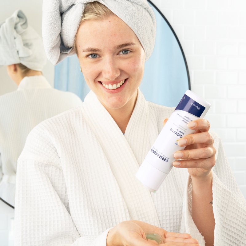 Photo of a woman applying the product.